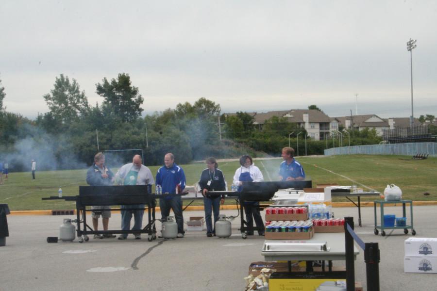 Faculty members cook for Bears BBQ