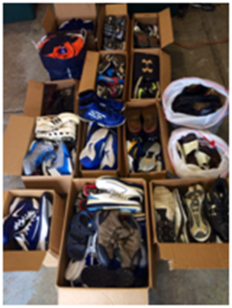 Boys basketball team donates shoes to charity