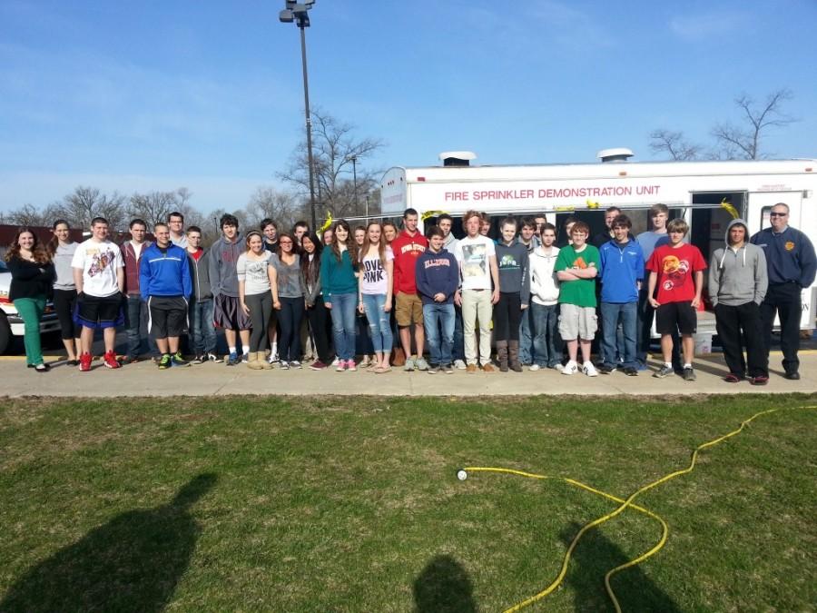 Lake Zurich Fire Department demonstrates fire sprinkler for science students