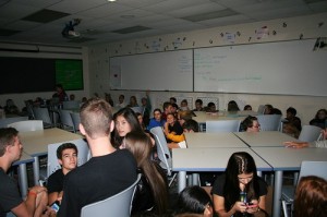 Students wait patiently in a dark classroom for the severe weather drill to finish. Multiple classrooms throughout the building were overcrowded with students during the drill, which is something in need of improvement, according to administration.  