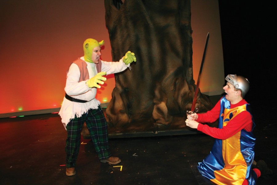 Shrek comes out of the swamp, onto the stage