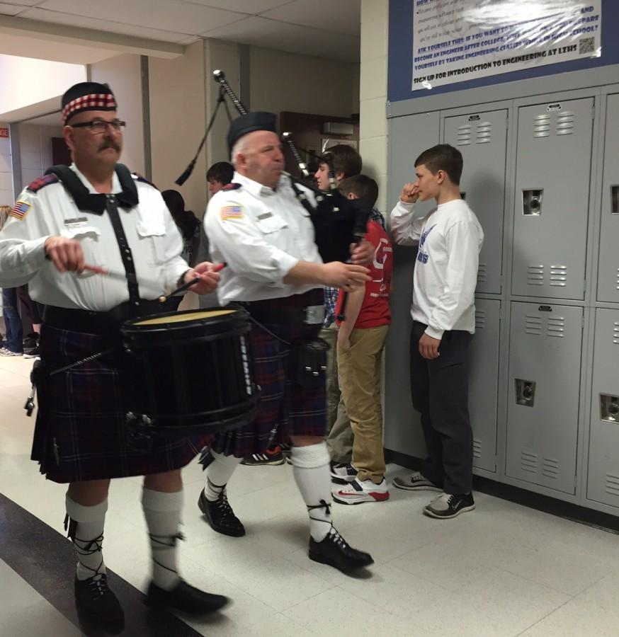 Bagpipe march celebrates Charity Bash total