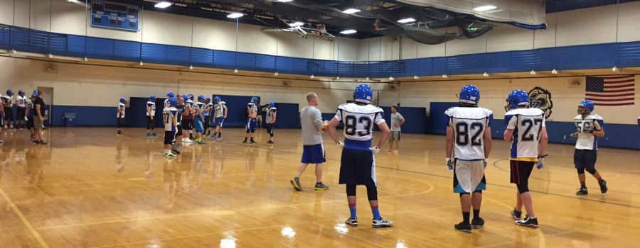 All sports camps were moved inside today due to severe weather. Football practiced in the Tonelli Gym, while cross country teams used hallways and the cafeteria. 