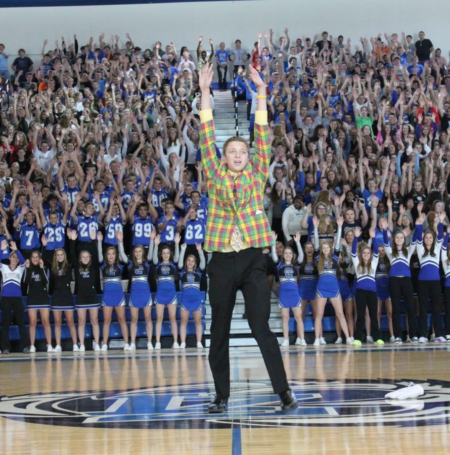 Last years Student Section Leader Drew Kowalski ignites the crowd at the 2014 Back To School Assembly. This year, Noah McGarr is trying to unite the school by allowing underclassmen to participate during theme days.
