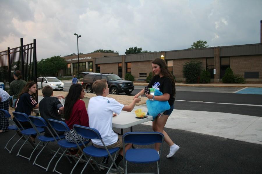 Students came to the football field expecting an ordinary movie night, but also got to share a sense of communion while waiting out the storm with peers.