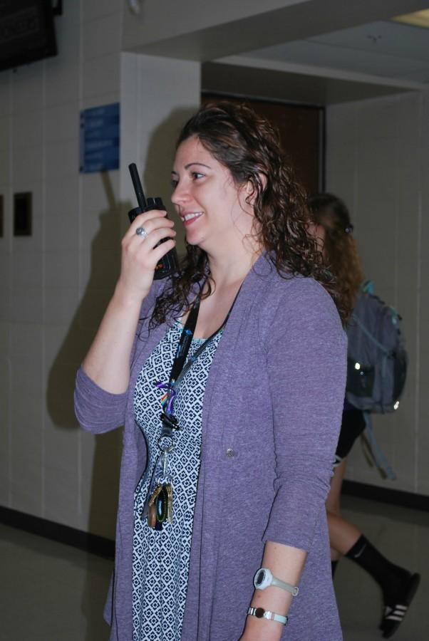 TIffany Reagan shows off her sleek radio. This connects to all administrators in the district.