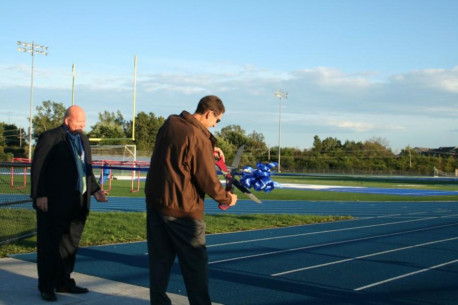 Goldberg cuts the ribbon at last nights ceremony. Students and other residents are now welcome to use the bleachers during upcoming events.