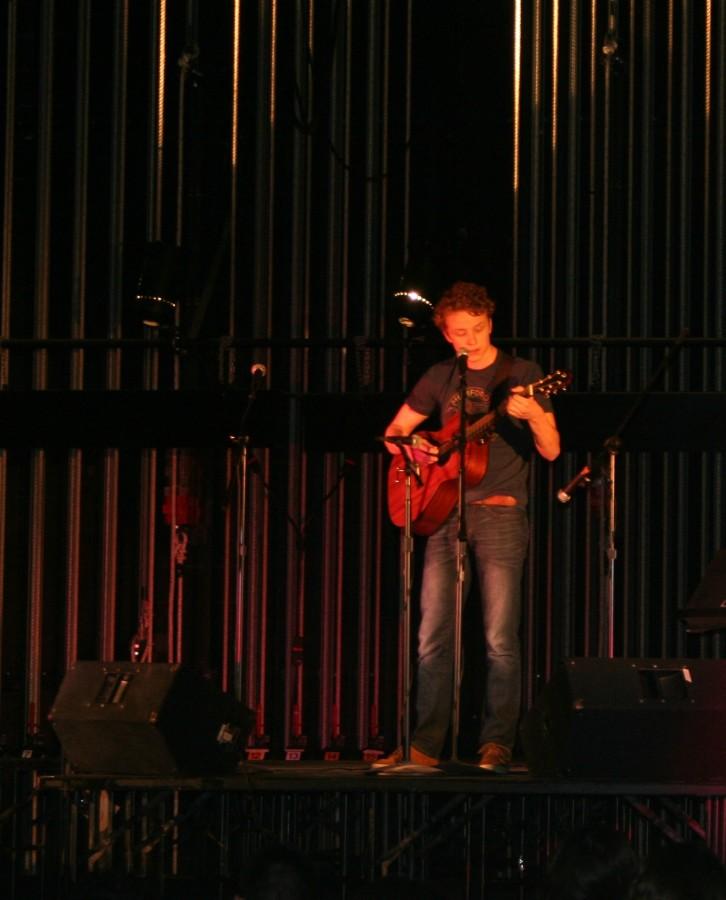 Zach Keller, senior, performs a song onstage at Coffee House. Keller is one of many drama club members who showcased an act.