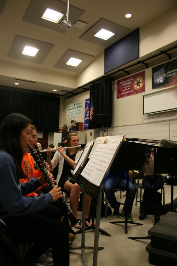  Band members in the Wind Ensemble practice their songs during sixth period. To prepare for the district band festival, students rehearse the songs they have been learning all year, along with extra songs that all district band members will perform together.