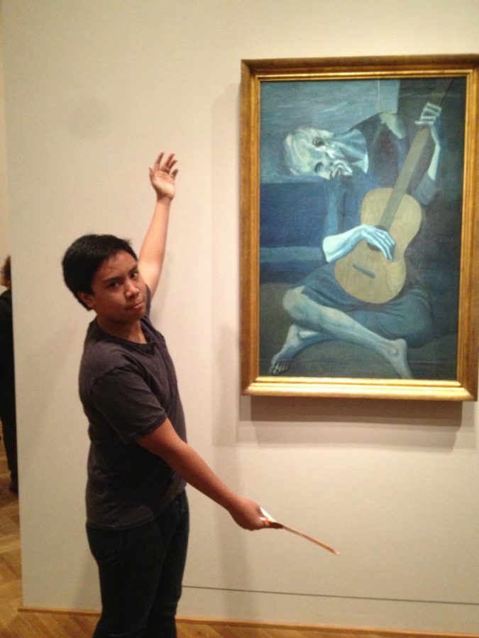 Julian Mauleon poses in front Pablo Picassos The Old Guitarist. The Spanish 4 students will be visiting the Art Institute to see works of the artists they have been studying in class. 