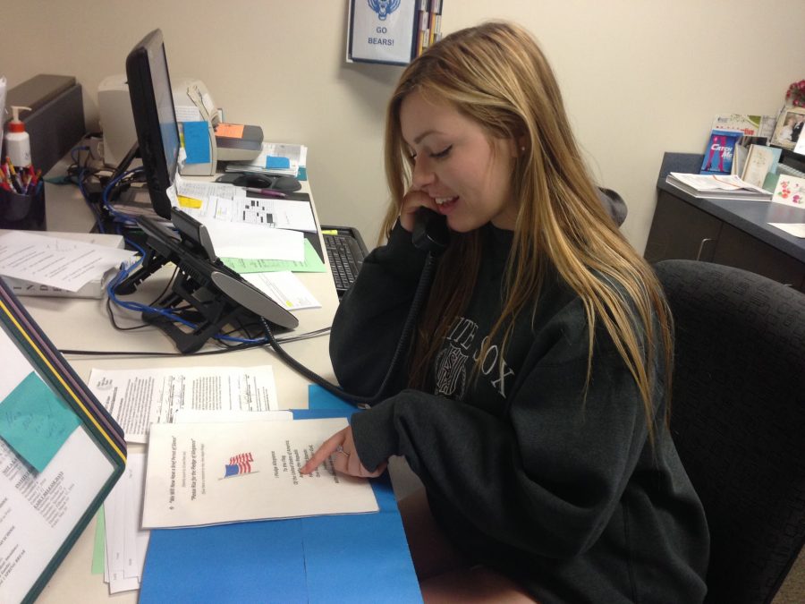 Amanda Sarsha, senior, recites the morning announcements for the school during first period. Sarsha and two other NHS students have three week rotations of the job.