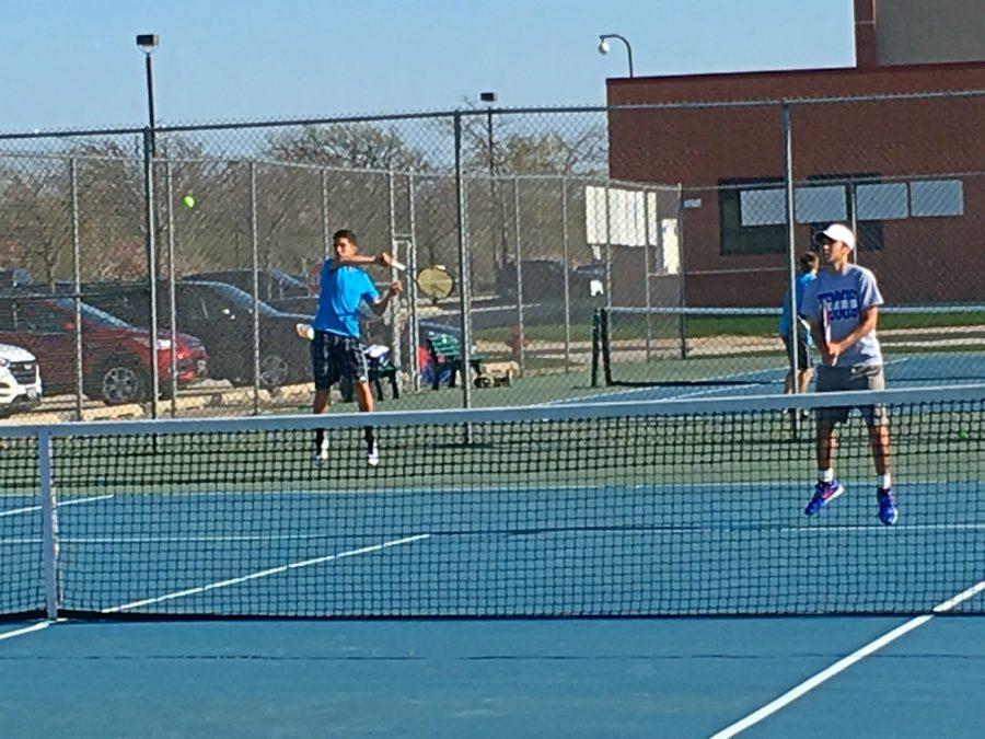 Roberto Guagnelli, junior in blue, has been playing tennis since he was about 10. Since then, he has played at the top of the school’s varsity tennis lineup for two years, and was in the top 80 in the midwest for USTA last year.