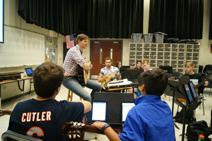 Nathan Sackschewsky, orchestra director and guitar teacher, plays along with his students. Im really enjoying my time her, Sackschewsky said. All of the orchestra and guitar students have been playing really really well, with great skill and great passion.