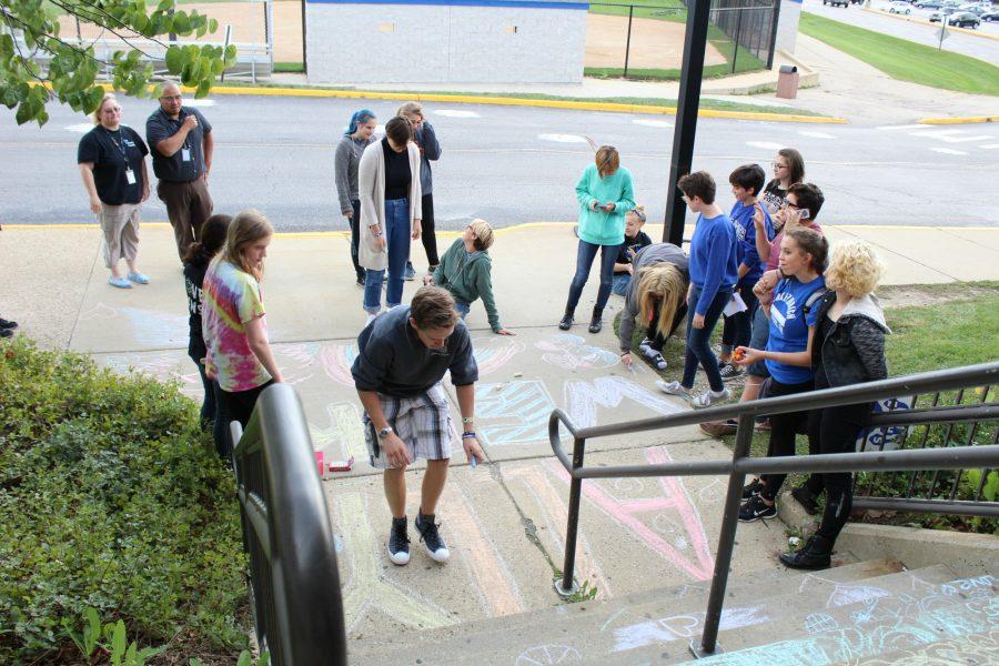 At+their+after+school+meeting%2C+the+GSA+decorates+the+stairs+in+a+rainbow+outside+the+senior+entrance+in+order+to+celebrate+Ally+Week.+The+gesture+is+meant+to+bring+awareness+and+to+thank+those+who+support+the+LGBT%2B+Community.