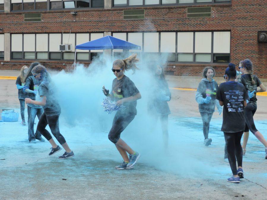 The halfway point for the runners and walkers is at the top of the hill by May Whitney where they are greeted by clouds of light blue.