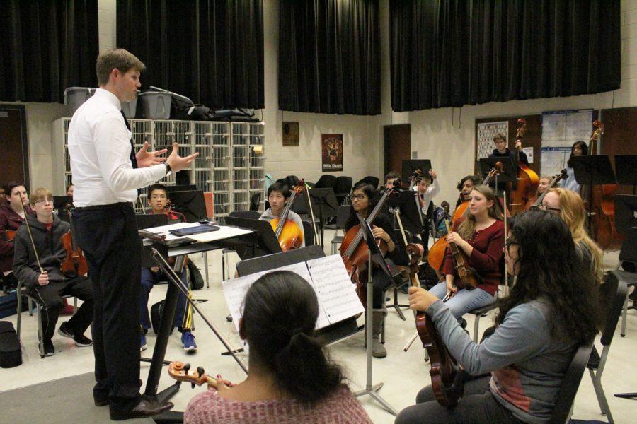 Nathan Sackschewsky, orchestra director, conducts his eighth period concert orchestra in rehearsal. The students practiced two pieces in anticipation of their upcoming concert.