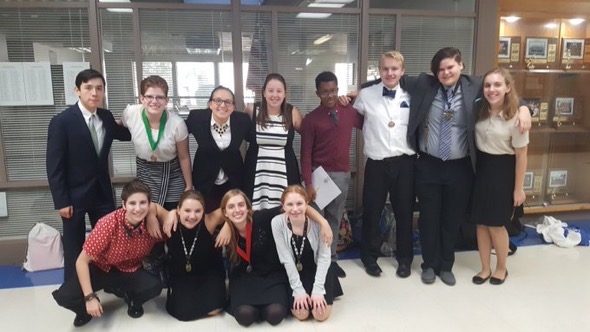 The Speech and Acting Team pose for a group photo after a competition. The team has been doing the best they've ever done this year, with multiple people placing at every competition the team have participated in.