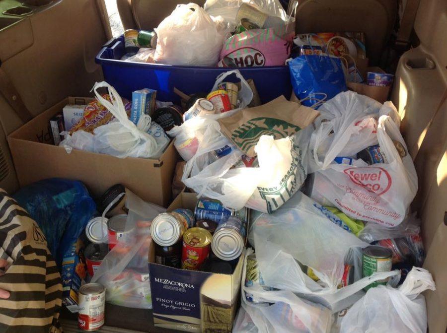 The NHS Orange Team gathered canned goods during Halloween for the St. Vincent de Paul Food Pantry. They are now teaming up with F.A.M.E. classes to collect additional food leading up to Thanksgiving.