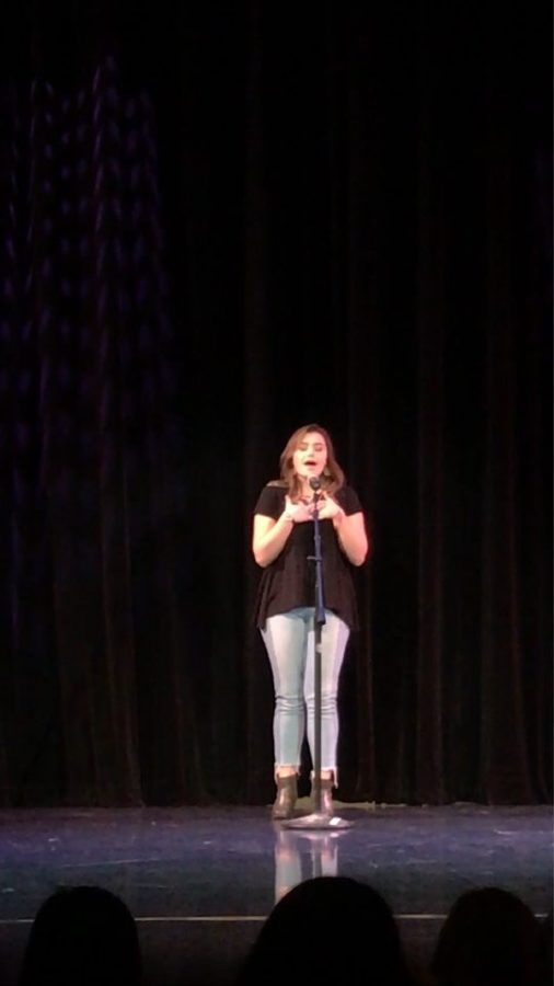 Mia Keeler, senior, performing at the talent show. Keeler received second place with her performance. 