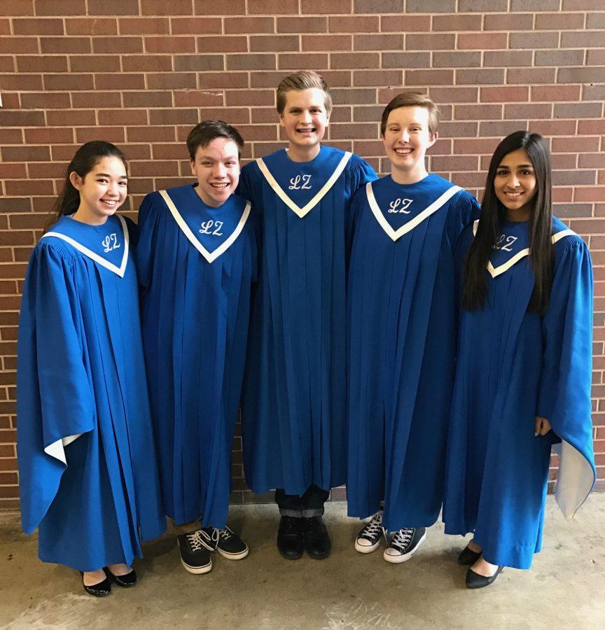 The five choir students who qualified for State gather for a picture. After practicing the song for weeks, the students from Lake Zurich along with around 200 students from other schools performed it together on Saturday.
