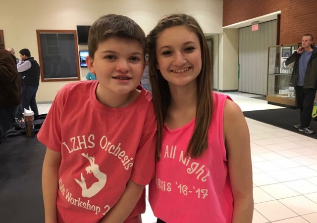 Lacey Ketcham, junior, stands with her 7th grade brother, Adam who has autism. 