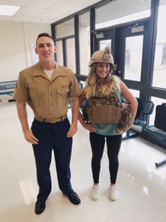 Pete Baldaccini, 2016 graduate, and his sister, Sedona Baldaccini, senior, pose with his US Marine Corps gear while on a visit to recruit LZHS students for the Marines.