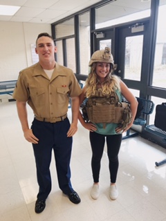 Pete Baldaccini, 2016 graduate, and his sister, Sedona Baldaccini, senior, pose with his US Marine Corps gear while on a visit to recruit LZHS students for the Marines. 