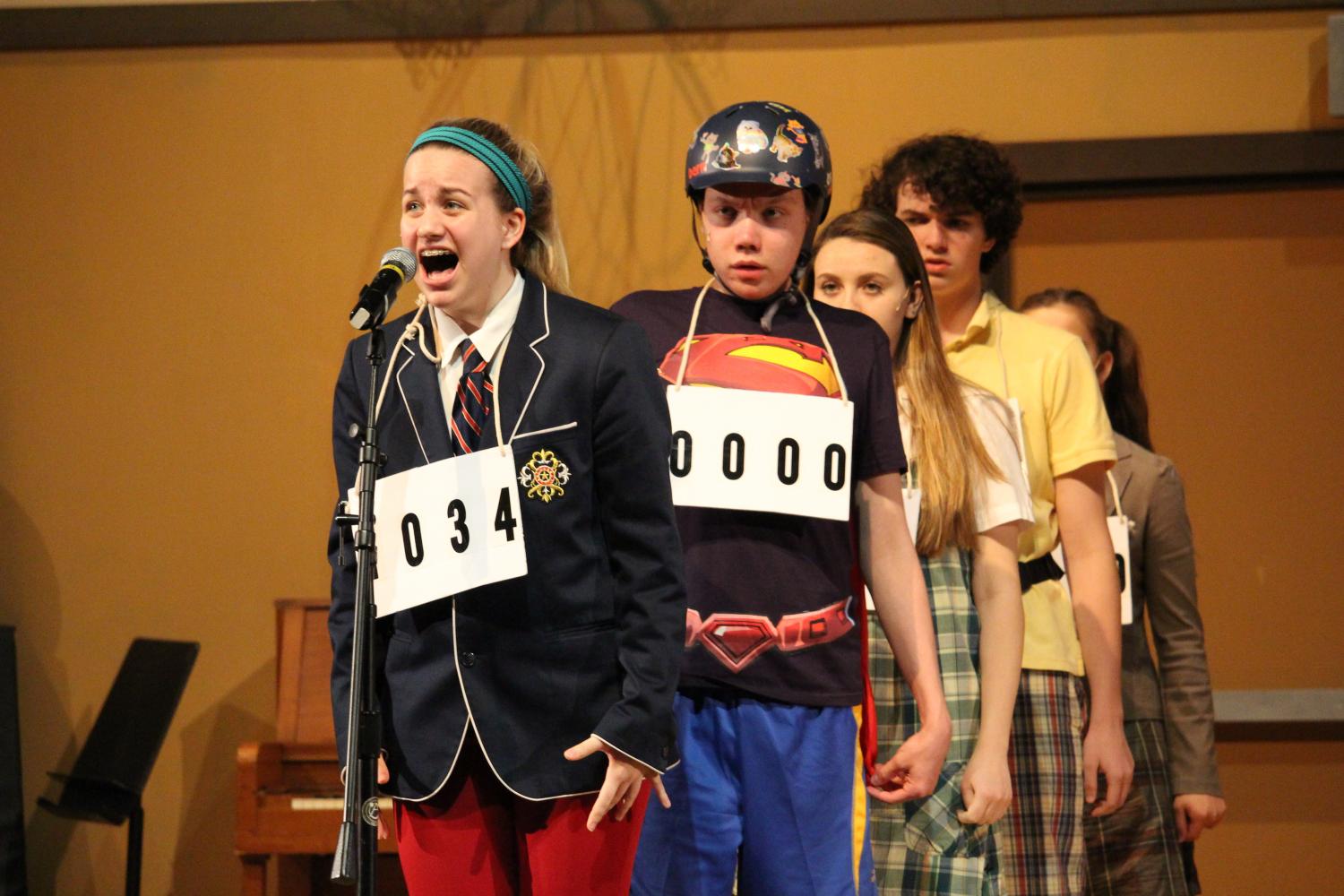 Logainne “Schwarzy” SchwartzandGrubenierre (Elizabeth Crutchfield, sophomore) steps up to the mic to spell. As the 6 contestants in the spelling bee work their way to the top, even audience members are given the chance to spell some of the words thrown at the awkward middle school characters.