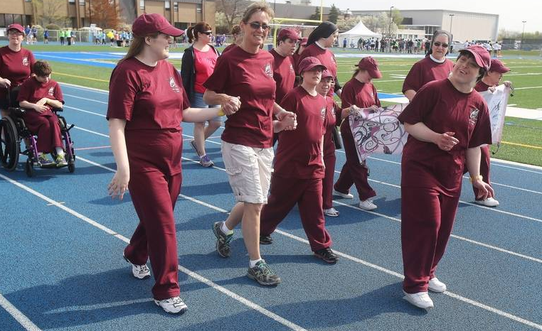Athletes participate in a 100m walk at the 2015-2016 Special Olympics