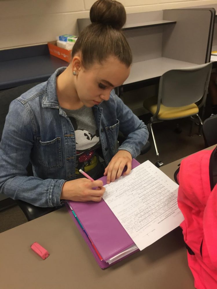 Natalie Barnes, sophomore, works hard on her homework in the Math Resource Center before school. 