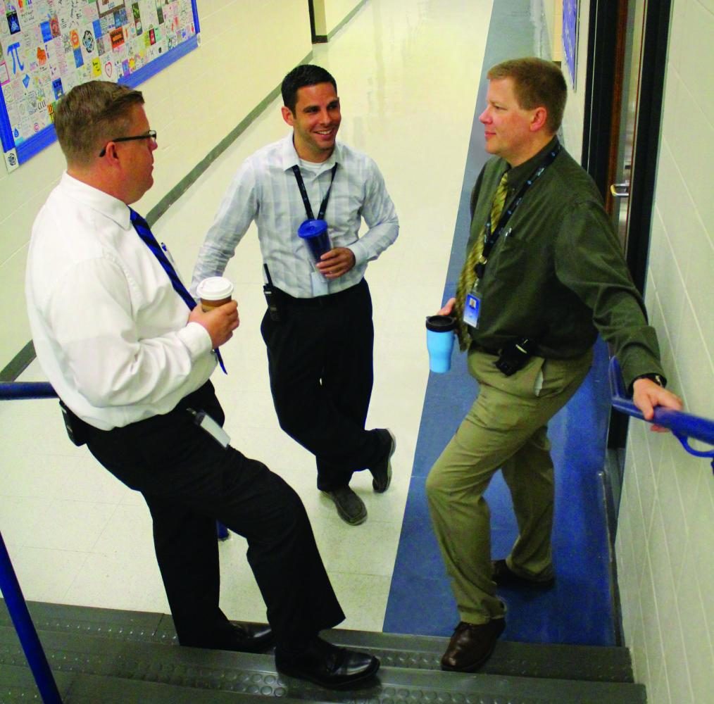 Bo Vossel (right), new principal for Lake Zurich High School, discusses the new school year with Andrew Lambert (left), new athletic director, and Matthew Aiello (center), dean of students. With LZHS welcoming various new faces this year, it will take time for faculty members to get to know these new comers.  