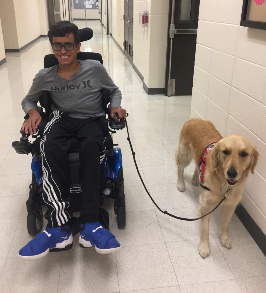 James Hunt, senior, poses with his service dog, Livy. Having Livy with him on a daily basis has been Hunt's