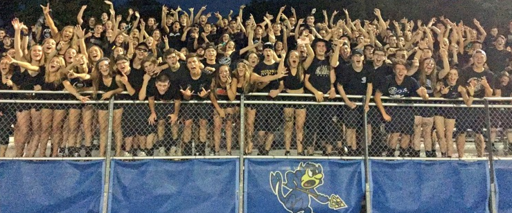  LZ students in blackout at football game against Zion-Benton. All grade levels collectively dressing up for theme days together helps support school theme of unity.