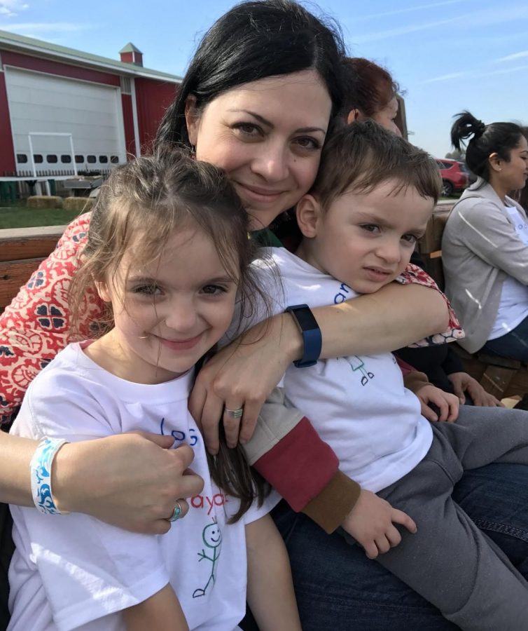 Martin and her kids pose during a family outing. Martin started a family in Illinois after living in South America for more than half of her life.