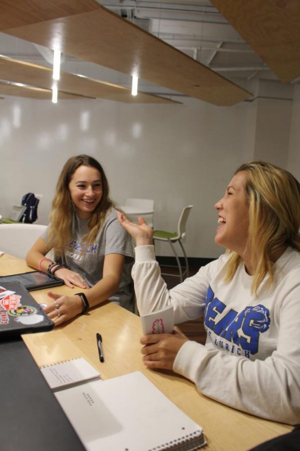 Leah Cunningham, freshman, has a few laughs with friend Lara Cardona, freshman, in Studio C during their study hall.  