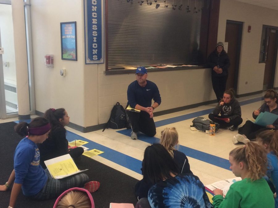 The new girls track and field coach, Jeremy Kauffman, meets with some of the girls for an open gym to prep for the season. After 22 years of experience in coaching, Kauffman comes to LZ with the goal of helping students get and do better.