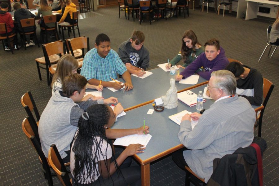 Students+listen+intently+to+one+of+the+experts+brought+in+to+speak+about+their+religion+for+the+World+Cultures+field+trip.++