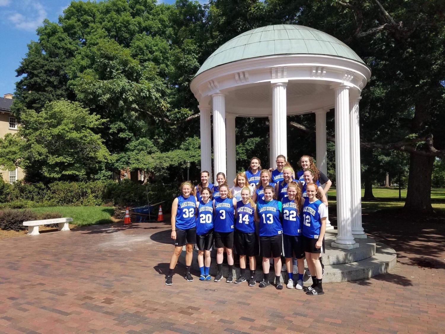 The varsity girls basketball team stands in front of the chapel at the University of North Carolina at Chapel Hill. The team traveled there for their summer camp this past summer in order to practice and increase their skills together.