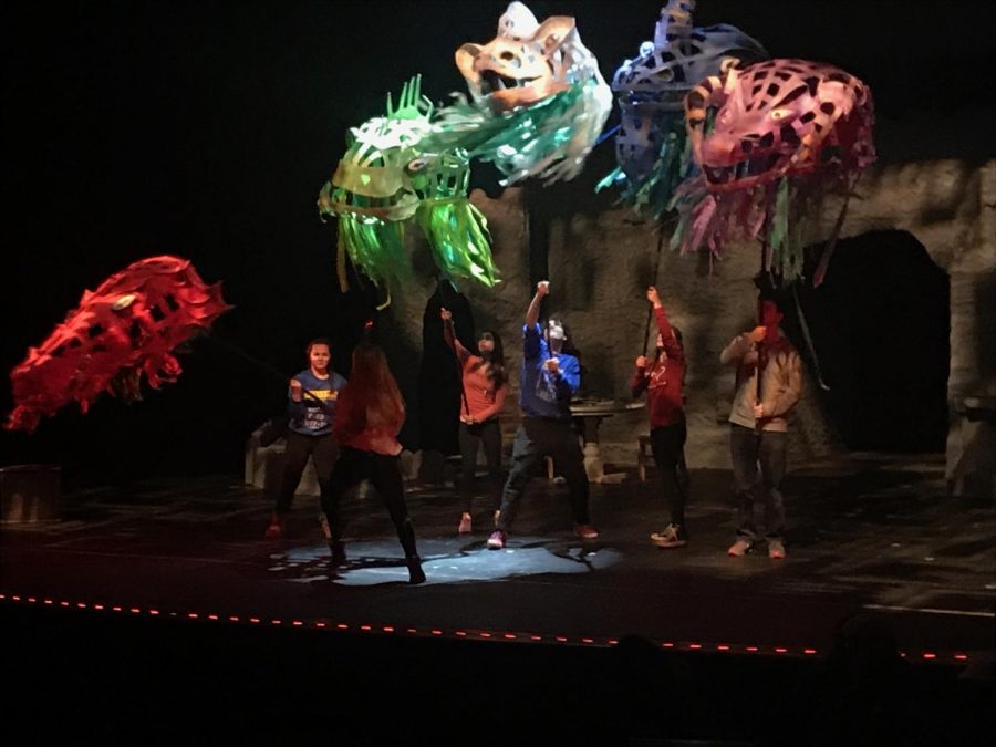 Five of the main characters in the winter play She Kills Monsters, hold up each of the dragon’s head. This is one of the final scenes as Agnes tries to defeat this monster called the Tiamat. 