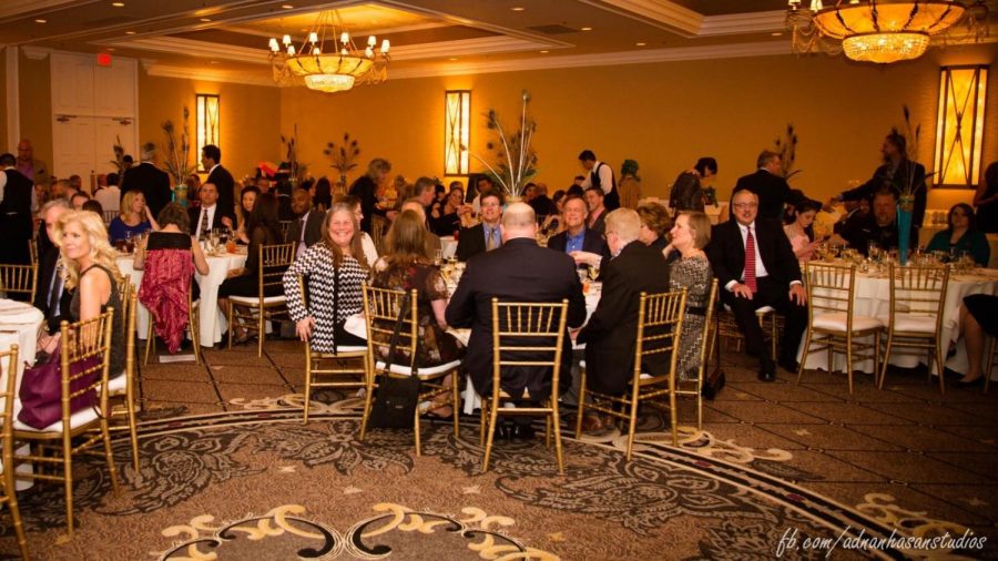 Adults converse during dinner at last years District 95 Education Foundation Gala. This years event is Oscar-themed and will take place in early March.