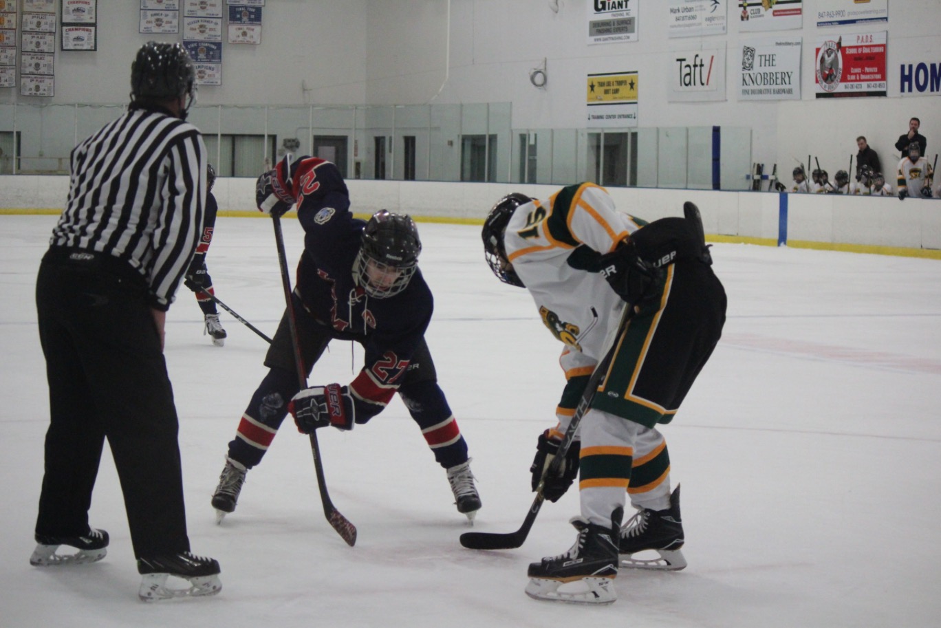 JV captain Jason Saab faces off in a game against Stevenson. JV is just one example of the LZMW hockey club’s improvement over the past few years.