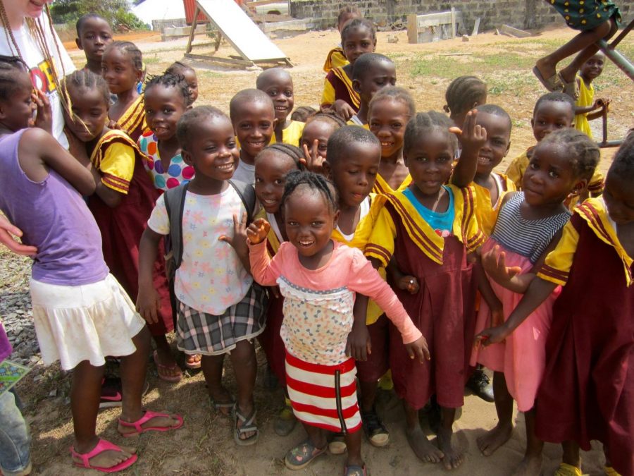 Liberian children from pose for a photo at Hope Academy. Olivia Noland, freshman, hopes to help Hope Academy by sending them school supplies.