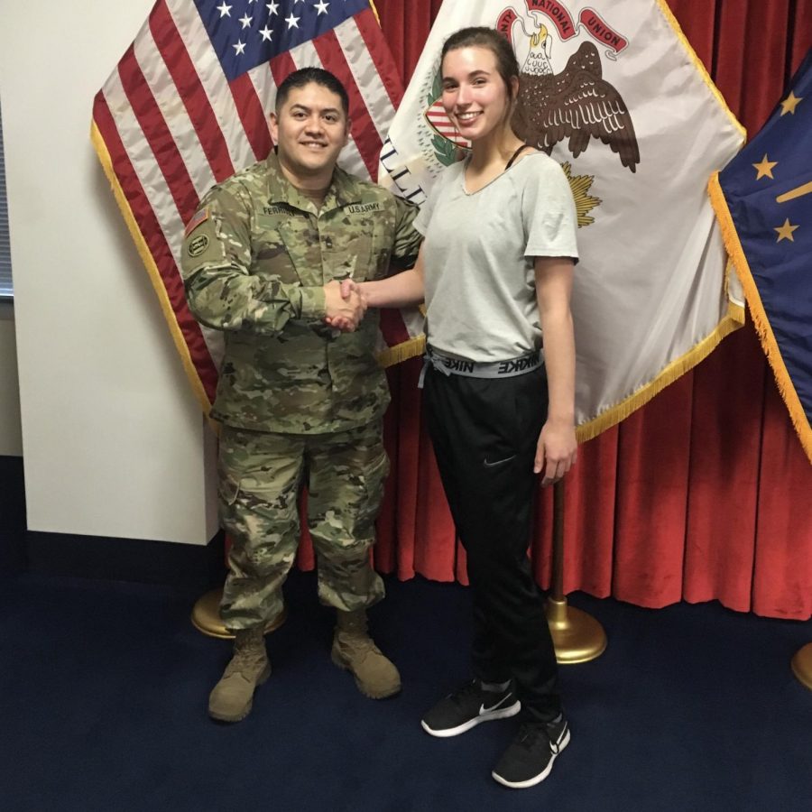 Danielle Vezensky pictured with a National guard officer. Taken shortly after Danielle was officially enlisted as a National Guard officer. Picture used with permission by Danielle Vezensky.