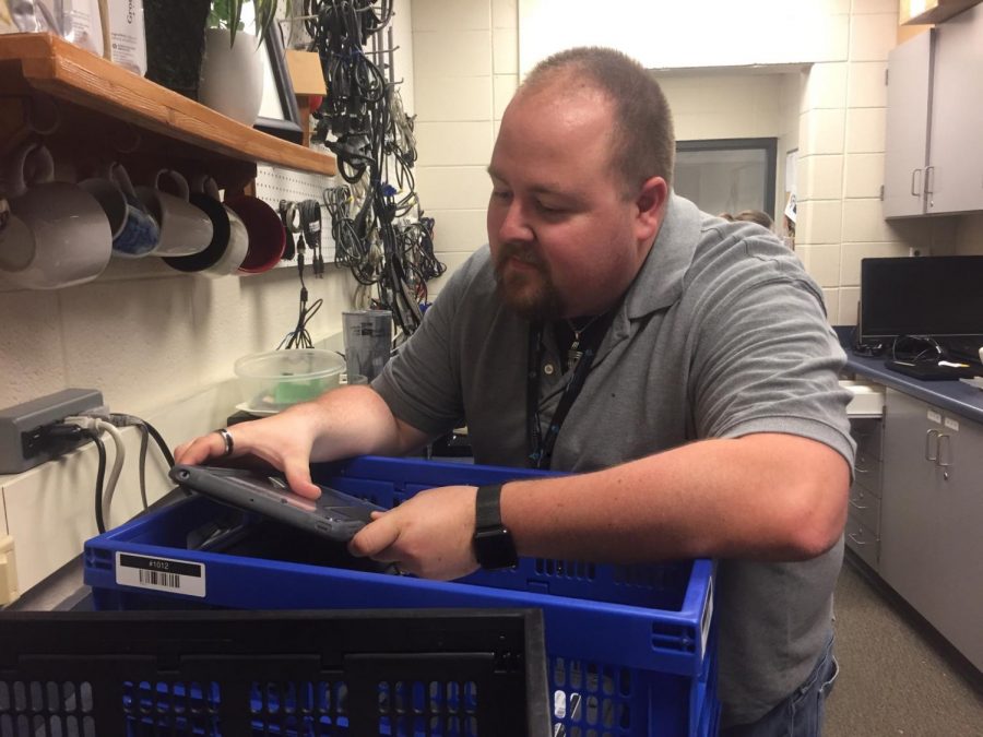 Steve Shepley, Apple tech specialist, goes through the iPads. Next year, iPads will update to managed IDs for students’ safety. 