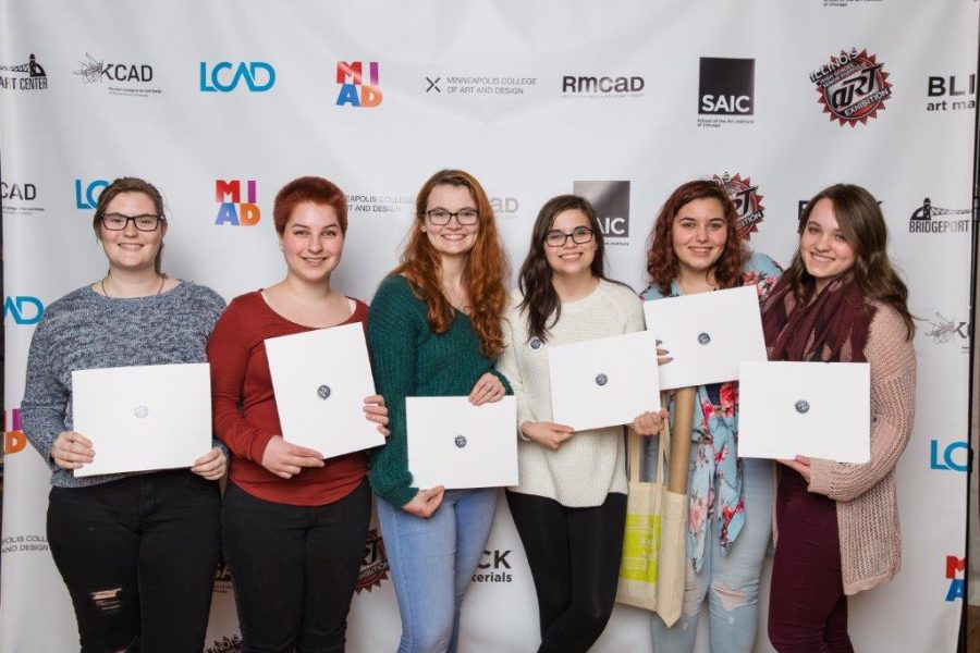 Seniors Bailey Recktenwald, Grace Bejnarowicz, Chloe Fletcher, Shayna Soloway, Gillian Teichman, and Lara Zuk stand with thier awards from the annual senior Art Show. Together, the senior girls were awarded almost one million dollars in scholarship money for different art schools around the nation. 