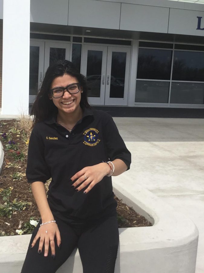 Sanchez wears a shirt from her criminal justice class at College of Lake County. She takes this class to help prepare her for detective work, her dream job.