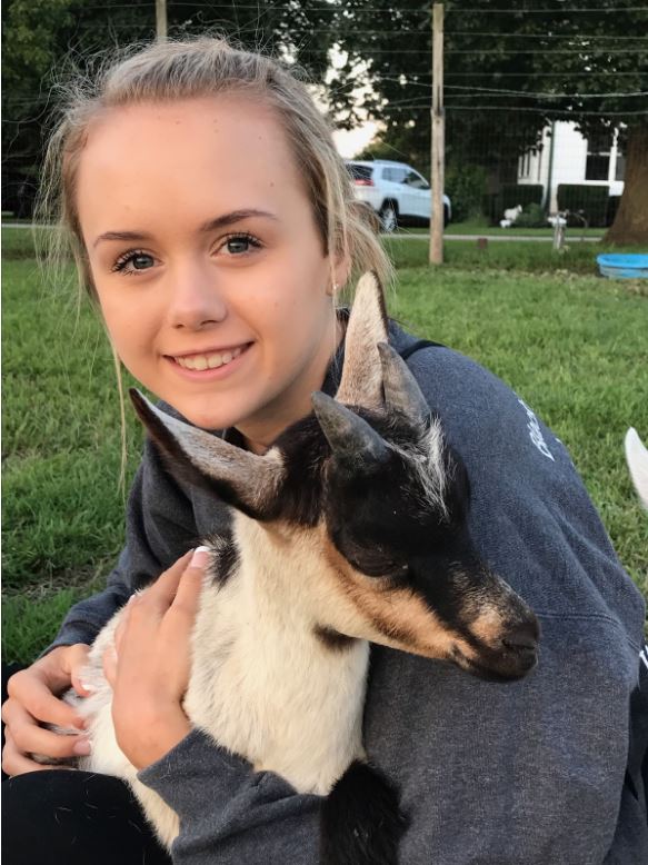 The girl who owns a goat