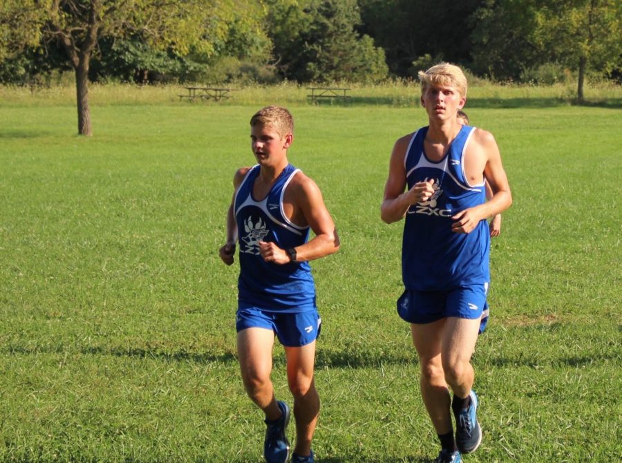 Two runners of the boys cross country team finishing their warmup. Members like these are going to have to work really hard considering the seniors are gone.