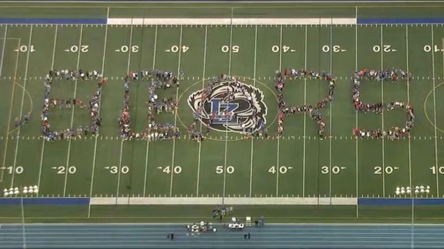 The second formation is of BEARS. Around 600 students showed up to support the school on television.