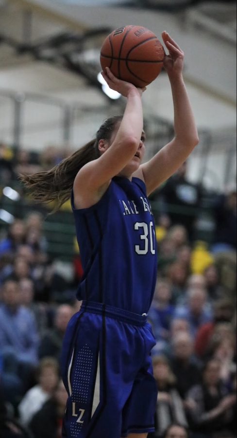 Grace Kinsey (2018 graduate) shoots at the hoop during the Warren Vs Lake Zurich Sectional Final. Girls sports, like Girls basketball, have been disrespected and overlooked for far too long, they deserve respect from their peers.
